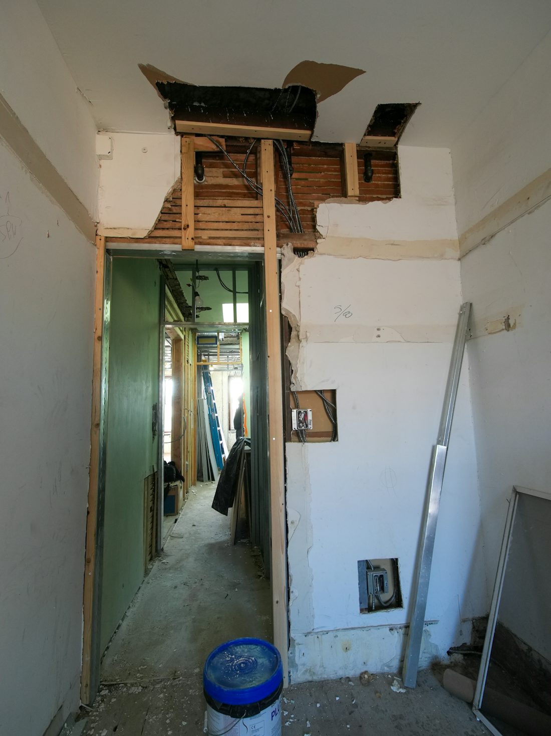Bathroom gutted to bare walls and exposed framing